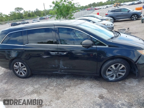 2014 Honda Odyssey Touring with VIN 5FNRL5H94EB057499, listed as a IAAI auction lot 41983956 with 158,573 mi miles and . Bid and sale history available at DreamBid. Image 13.
