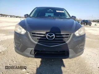 2016 Mazda CX-5 Sport with VIN JM3KE2BE9G0650543, listed as a Copart auction lot 41987795 with 163,528 mi miles and Salvage Title. Bid and sale history available at carsss.com. Image 5.