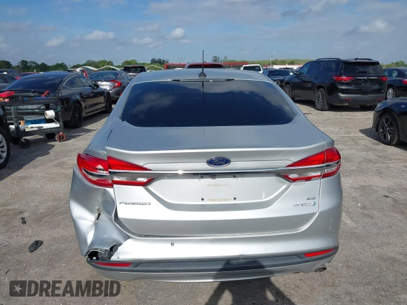 2018 Ford Fusion SE z VIN 3FA6P0LU2JR281231, wystawiony jako IAAI lot #41963083 z przebiegiem 115 434 mil mil oraz . Historia ofert i sprzedaży dostępna na DreamBid. Obrazek 16.