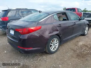 2011 Kia Optima LX with VIN KNAGM4A73B5063778, listed as a IAAI auction lot 39932051 with 143,175 mi miles. Bid and sale history available at carsss.com. Image 4.