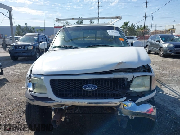 2002 Ford F-150 XL with VIN 1FTRX17L82NA54581, listed as a IAAI auction lot 41698662 with 220,321 mi miles. Bid and sale history available at carsss.com. Image 12.