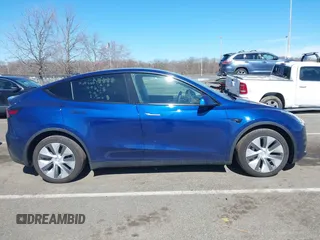 2020 Tesla Model Y Long Range with VIN 5YJYGDEF4LF005534, listed as a IAAI auction lot 41830910 with 32,438 mi miles and . Bid and sale history available at DreamBid. Image 12.