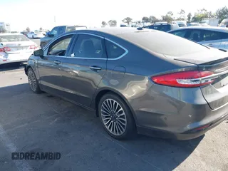 2017 Ford Fusion Titanium z VIN 3FA6P0SU5HR105477, wystawiony jako IAAI lot #41072696 z przebiegiem 92 926 mil mil oraz . Historia ofert i sprzedaży dostępna na DreamBid. Obrazek 14.