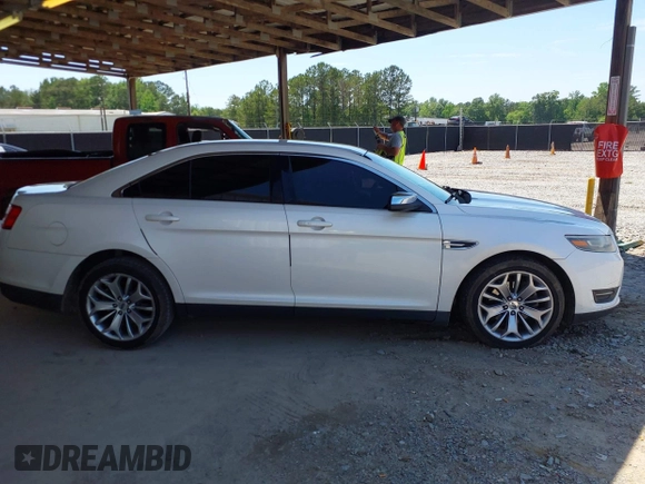 2015 Ford Taurus Limited z VIN 1FAHP2F89FG101017, wystawiony jako IAAI lot #42284459 z przebiegiem 183 167 mil mil oraz . Historia ofert i sprzedaży dostępna na DreamBid. Obrazek 13.