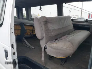 1997 Ford Econoline Wagon XL z VIN 1FBJS31L3VHB66356, wystawiony jako IAAI lot #39189974 z przebiegiem 242 944 mil mil oraz . Historia ofert i sprzedaży dostępna na DreamBid. Obrazek 8.