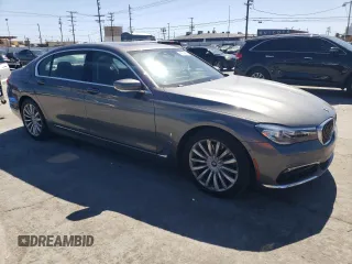 2018 BMW 7 Series 740e xDrive with VIN WBA7J2C55JG938385, listed as a Copart auction lot 49109985 with 81,567 mi miles and Salvage Title. Bid and sale history available at DreamBid. Image 4.