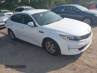 2016 Kia Optima LX z VIN 5XXGT4L32GG119101, wystawiony jako IAAI lot #42408140 z przebiegiem 129 898 mil mil oraz . Historia ofert i sprzedaży dostępna na DreamBid. Obrazek 1.