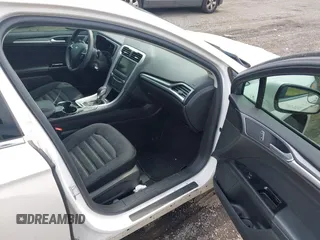 2014 Ford Fusion SE Hybrid z VIN 3FA6P0LU3ER391680, wystawiony jako IAAI lot #42643934 z przebiegiem 102 578 mil mil oraz . Historia ofert i sprzedaży dostępna na DreamBid. Obrazek 5.