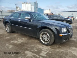 2009 Chrysler 300 with VIN 2C3LK33V19H614083, listed as a Copart auction lot 77529014 with 188,125 mi miles and Salvage title. Bid and sale history available at DreamBid. Image 4.