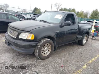 2001 Ford F-150 XL with VIN 2FTZF07211CA54107, listed as a IAAI auction lot 41450483 with 153,699 mi miles. Bid and sale history available at carsss.com. Image 2.