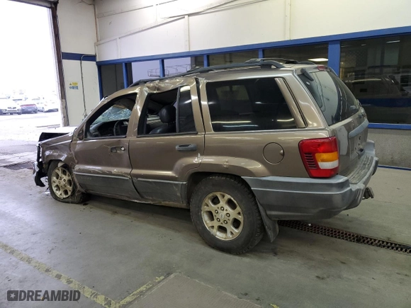2001 Jeep Grand Cherokee Laredo with VIN 1J4GW48N01C529690, listed as a Copart auction lot 82037774 with 142,673 mi miles and Salvage Title. Bid and sale history available at carsss.com. Image 2.