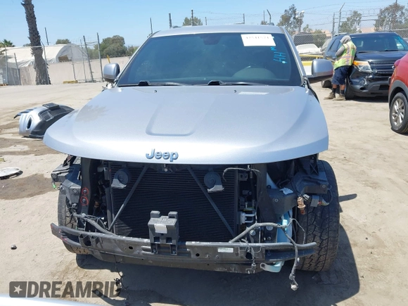 2018 Jeep Grand Cherokee Laredo E with VIN 1C4RJEAG2JC429850, listed as a IAAI auction lot 42541574 with 72,009 mi miles and . Bid and sale history available at DreamBid. Image 13.