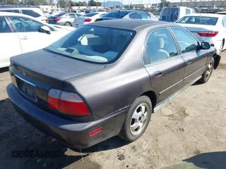 1997 Honda Accord Special Edition with VIN 1HGCD5605VA107036, listed as a IAAI auction lot 41674182 with 236,341 mi miles and . Bid and sale history available at carsss.com. Image 4.