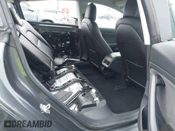 2018 Tesla Model 3 Long Range Battery with VIN 5YJ3E1EB7JF114305, listed as a IAAI auction lot 41765994 with 76,945 mi miles and . Bid and sale history available at DreamBid. Image 8.