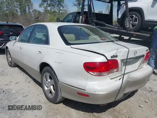 2001 Mazda Millenia with VIN JM1TA221011711379, listed as a IAAI auction lot 41897580 with 151,307 mi miles and . Bid and sale history available at DreamBid. Image 3.