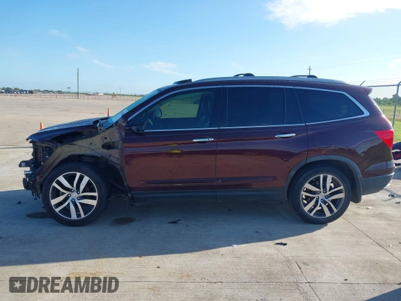 2017 Honda Pilot Touring with VIN 5FNYF5H96HB038413, listed as a IAAI auction lot 42594065 with 130,501 mi miles and . Bid and sale history available at DreamBid. Image 14.