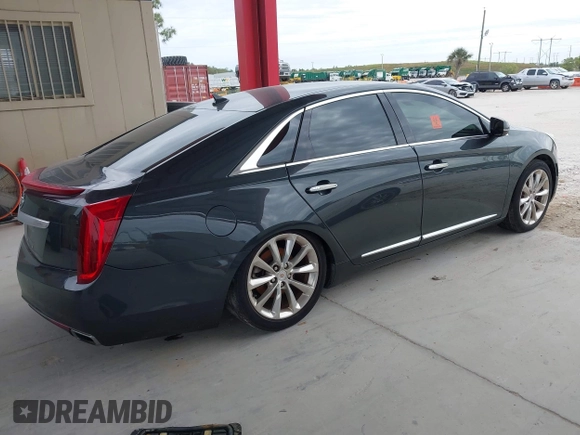 2014 Cadillac XTS Luxury with VIN 2G61M5S33E9217619, listed as a IAAI auction lot 41343003 with 126,303 mi miles. Bid and sale history available at carsss.com. Image 4.