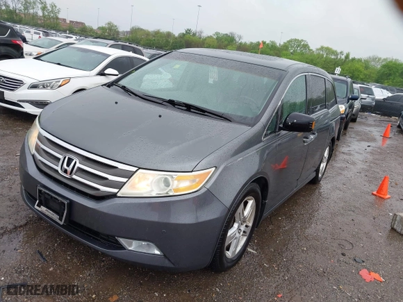 2012 Honda Odyssey Touring with VIN 5FNRL5H92CB073455, listed as a IAAI auction lot 42091700 with 243,919 mi miles. Bid and sale history available at carsss.com. Image 17.
