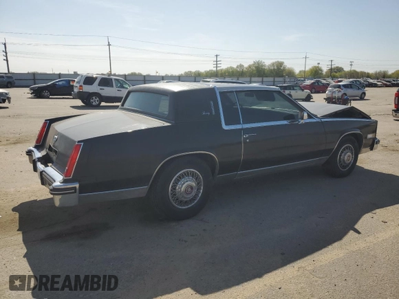 1985 Cadillac Eldorado z VIN 1G6EL5780FE622179, wystawiony jako Copart lot #54109205 z przebiegiem 73 403 mil mil oraz Szkoda całkowita • Salvage title. Historia ofert i sprzedaży dostępna na DreamBid. Obrazek 3.