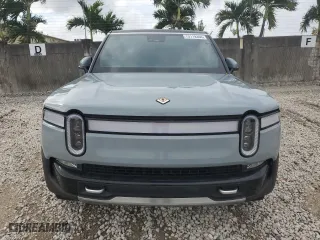2024 Rivian R1S Adventure with VIN 7PDSGABA1RN031380, listed as a Copart auction lot 73119354 with 6,786 mi miles and Salvage Title. Bid and sale history available at carsss.com. Image 5.