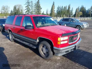 1996 GMC Suburban with VIN 1GKFK16R4TJ742646, listed as a IAAI auction lot 42004439 with 196,923 mi miles. Bid and sale history available at carsss.com. Image 1.