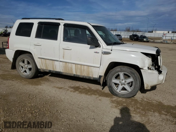 2010 Jeep Patriot Sport with VIN 1J4NF2GB2AD525475, listed as a Copart auction lot 51986785 with 90,659 mi miles and Salvage Title. Bid and sale history available at carsss.com. Image 4.