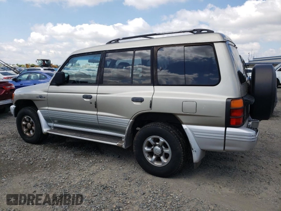 1998 Mitsubishi Montero z VIN JA4MR51RXWJ006418, wystawiony jako Copart lot #54878275 z przebiegiem 225 110 mil mil oraz Szkoda całkowita • Salvage title. Historia ofert i sprzedaży dostępna na DreamBid. Obrazek 2.