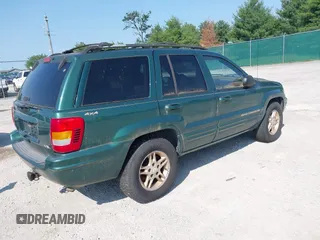 1999 Jeep Grand Cherokee Limited z VIN 1J4GW68N5XC630910, wystawiony jako IAAI lot #42380978 z przebiegiem 188 300 mil mil oraz . Historia ofert i sprzedaży dostępna na DreamBid. Obrazek 4.