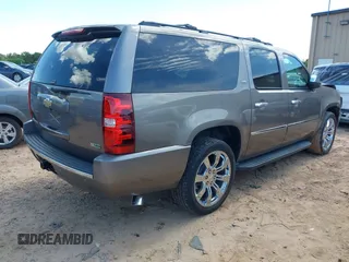 2011 Chevrolet Suburban LTZ with VIN 1GNSKKE3XBR394436, listed as a IAAI auction lot 42324225 with 132,871 mi miles and . Bid and sale history available at DreamBid. Image 4.