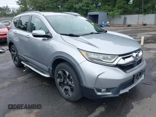 2017 Honda CR-V Touring with VIN 2HKRW2H96HH615641, listed as a IAAI auction lot 42603987 with 74,841 mi miles and . Bid and sale history available at DreamBid. Image 1.