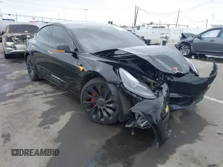 2022 Tesla Model 3 Performance with VIN 5YJ3E1EC3NF248534, listed as a IAAI auction lot 41882694 with 55,415 mi miles. Bid and sale history available at carsss.com. Image 1.