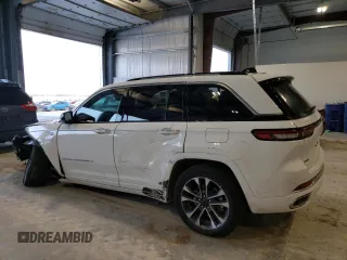 2022 Jeep Grand Cherokee Overland with VIN 1C4RJYD68N8716557, listed as a Copart auction lot 86807614 with 12,590 mi miles and Salvage title. Bid and sale history available at DreamBid. Image 2.