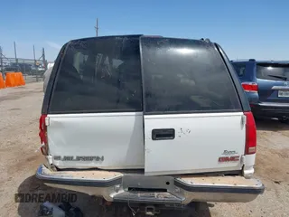 1999 GMC Suburban with VIN 1GDFK16R0XJ728255, listed as a IAAI auction lot 42230595 with Not provided miles and . Bid and sale history available at DreamBid. Image 16.