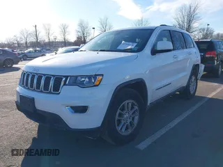 2019 Jeep Grand Cherokee Laredo E with VIN 1C4RJFAG7KC694674, listed as a IAAI auction lot 41591678 with 61,144 mi miles. Bid and sale history available at carsss.com. Image 2.