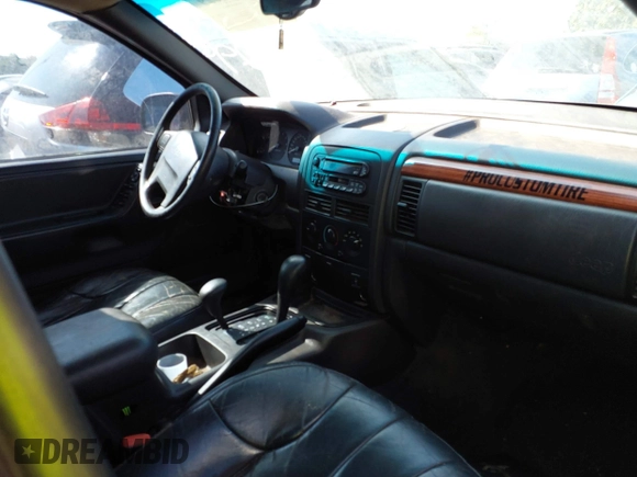 1999 Jeep Grand Cherokee Laredo with VIN 1J4GW58S0XC678864, listed as a IAAI auction lot 37593033 with Not provided miles and . Bid and sale history available at DreamBid. Image 5.