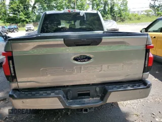 2023 Ford F-150 Lightning Pro z VIN 1FTVW1EL3PWG61686, wystawiony jako Copart lot #61353535 z przebiegiem 8 116 mil mil oraz Szkoda całkowita • Salvage title. Historia ofert i sprzedaży dostępna na DreamBid. Obrazek 6.