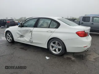 2014 BMW 3 Series 328i with VIN WBA3C1C50EK116423, listed as a Copart auction lot 61422515 with 166,006 mi miles and Salvage title. Bid and sale history available at DreamBid. Image 2.