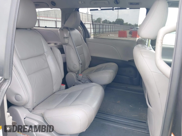 2015 Toyota Sienna XLE with VIN 5TDYK3DCXFS688971, listed as a IAAI auction lot 42127912 with 143,024 mi miles. Bid and sale history available at carsss.com. Image 8.