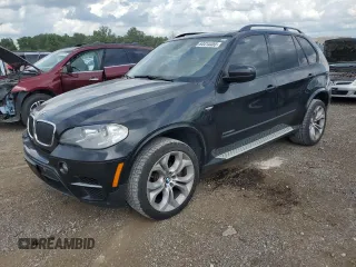 2012 BMW X5 50i with VIN 5UXZV8C51CL424965, listed as a Copart auction lot 64414455 with 121,894 mi miles and Clean title. Bid and sale history available at DreamBid. Image 1.
