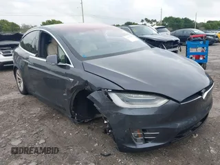 2020 Tesla Model X Long Range with VIN 5YJXCAE21LF233168, listed as a IAAI auction lot 41357086 with 1 mi miles. Bid and sale history available at carsss.com. Image 1.