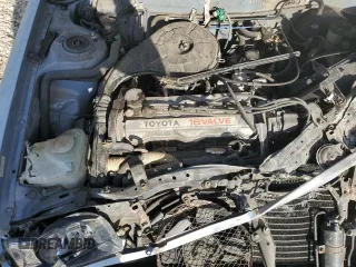 1988 Toyota Corolla z VIN JT2AE92E9J3140852, wystawiony jako Copart lot #74968874 z przebiegiem 169 427 mil mil oraz Szkoda całkowita • Salvage title. Historia ofert i sprzedaży dostępna na DreamBid. Obrazek 11.