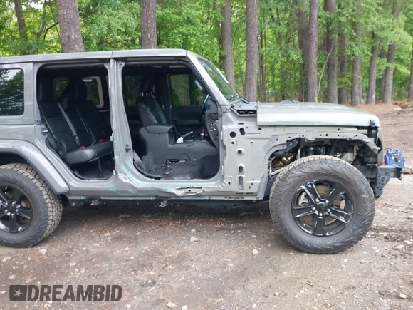 2021 Jeep Wrangler Unlimited Sahara with VIN 1C4HJXEG0MW703812, listed as a IAAI auction lot 42186089 with 50,349 mi miles and . Bid and sale history available at DreamBid. Image 6.
