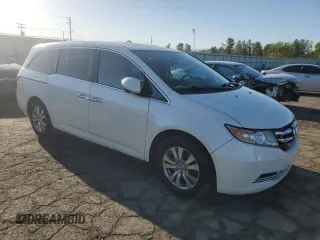 2014 Honda Odyssey EX-L with VIN 5FNRL5H61EB005740, listed as a Copart auction lot 54663595 with 118,971 mi miles and Salvage Title. Bid and sale history available at DreamBid. Image 4.