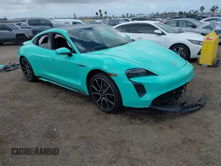 2022 Porsche Taycan 4S z VIN WP0AB2Y12NSA45396, wystawiony jako IAAI lot #41946433 z przebiegiem 9389 mil mil oraz . Historia ofert i sprzedaży dostępna na DreamBid. Obrazek 1.