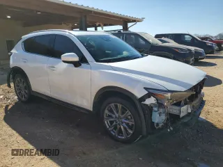 2021 Mazda CX-5 Signature with VIN JM3KFBEY5M0352778, listed as a Copart auction lot 47016035 with 37,961 mi miles and Salvage Title. Bid and sale history available at carsss.com. Image 4.