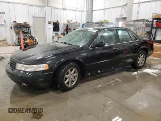 1999 Cadillac Seville Touring STS z VIN 1G6KY5494XU941299, wystawiony jako Copart lot #43018335 z przebiegiem 101 617 mil mil oraz Czysty tytuł • Clean title. Historia ofert i sprzedaży dostępna na DreamBid. Obrazek 1.