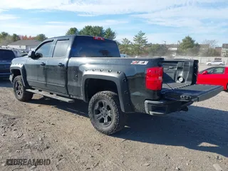 2017 Chevrolet Silverado 1500 LT with VIN 1GCVKREC0HZ293560, listed as a IAAI auction lot 40706331 with 133,438 mi miles. Bid and sale history available at carsss.com. Image 3.