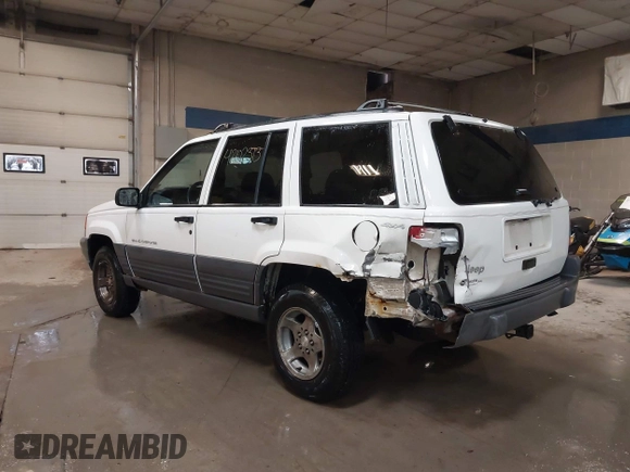 1997 Jeep Grand Cherokee Laredo z VIN 1J4GZ58S9VC562907, wystawiony jako IAAI lot #42102313 z przebiegiem 137 672 mil mil oraz . Historia ofert i sprzedaży dostępna na DreamBid. Obrazek 3.