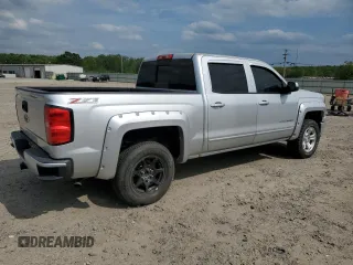 2015 Chevrolet Silverado 1500 LT with VIN 3GCUKREC9FG147988, listed as a Copart auction lot 53784635 with 218,260 mi miles and Salvage Title. Bid and sale history available at DreamBid. Image 3.
