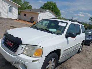 2003 GMC Envoy SLE with VIN 1GKES16S136153880, listed as a IAAI auction lot 42009798 with 289,208 mi miles and . Bid and sale history available at DreamBid. Image 2.